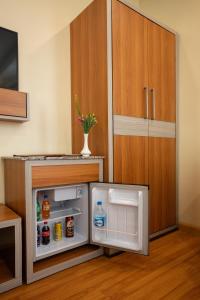 A cozinha ou kitchenette de Magnificent Hotel