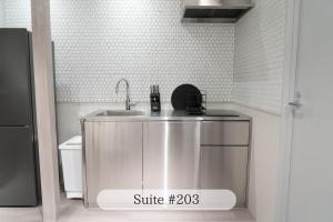 Kuchyň nebo kuchyňský kout v ubytování UNPLAN Residence suite