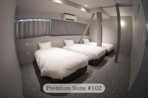 Postel nebo postele na pokoji v ubytování UNPLAN Residence suite