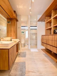 a bathroom with a sink and a toilet at Xielo in Tulum +16 photos