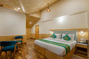 Postelja oz. postelje v sobi nastanitve Treebo Premium Silverstone Resort With Mountain Valley View
