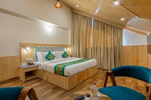 Postelja oz. postelje v sobi nastanitve Treebo Premium Silverstone Resort With Mountain Valley View