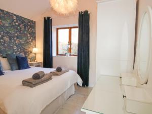 Ένα ή περισσότερα κρεβάτια σε δωμάτιο στο Stoney-Brook Lodge