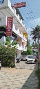 a car parked in front of a building at Tabish INN in Trivandrum