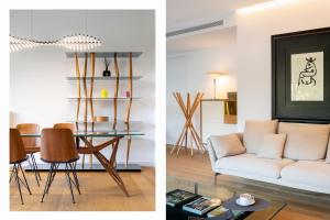 a living room and dining room with a couch and a table at Magno Apartment Ramón Carande- Private Parking included in Seville +26 photos