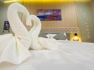 Postel nebo postele na pokoji v ubytování Asawann Hotel Suvarnabhumi