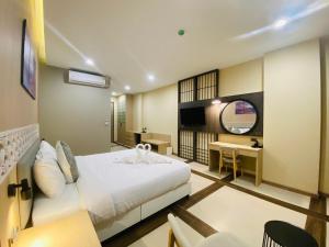 Postel nebo postele na pokoji v ubytování Asawann Hotel Suvarnabhumi
