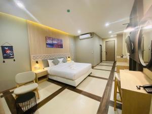Postel nebo postele na pokoji v ubytování Asawann Hotel Suvarnabhumi