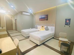 Postel nebo postele na pokoji v ubytování Asawann Hotel Suvarnabhumi
