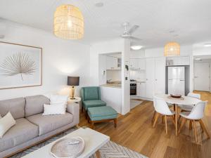 a living room with a couch and a table at Goldsborough Place Apartments in Brisbane