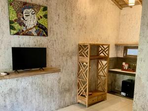 TV a/nebo společenská místnost v ubytování Baliwid Villa Ubud