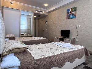 Postel nebo postele na pokoji v ubytování Arena Hotel Khachmaz