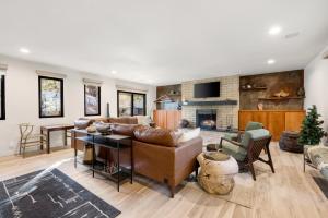 a living room with a couch and a fireplace at Boulder Bungalow in Prescott