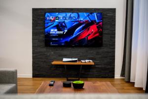 TV a/nebo společenská místnost v ubytování IT Centrum Apartments