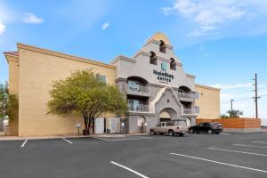 a building with a truck parked in a parking lot at Comfort Inn & Suites El Centro I-8 in El Centro