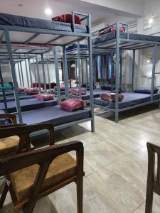 a room filled with lots of bunk beds at NANDI RETREAT HomeStay in Varanasi +48 photos