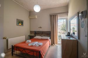 Posteľ alebo postele v izbe v ubytovaní Bikakis Family Apartments