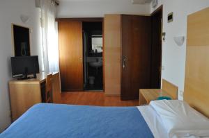 Postel nebo postele na pokoji v ubytování Hotel Igea