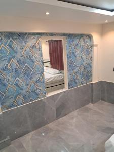 Rúm í herbergi á Rameshwaram Guest House