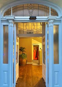 an entrance to a house with a blue door at Crashpalace Napier in Napier +61 photos