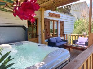 a jacuzzi tub on the porch of a house at La pampa in Cabannes