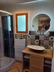 a bathroom with a sink and a shower at La pampa in Cabannes