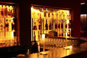 a bunch of wine glasses on a bar at Khai Karaköy in Istanbul