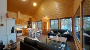 a living room with a couch and a table at Porotieva in Posio