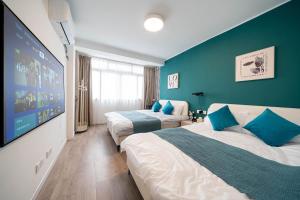 Postel nebo postele na pokoji v ubytování 柃居 B&B - People's Square Branch