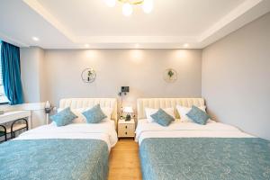 Postel nebo postele na pokoji v ubytování 柃居 B&B - People's Square Branch