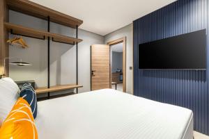 TV a/nebo společenská místnost v ubytování Four Points Flex by Sheraton Ankara Cukurambar