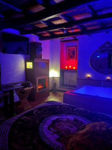 a living room with a pool table and a fireplace at SP Golden House in Bracciano