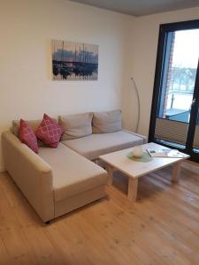 Χώρος καθιστικού στο Ferienwohnung Hafenblick 2 6 in der Speicher Residenz