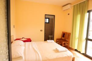 Postel nebo postele na pokoji v ubytování Haka Guesthouse