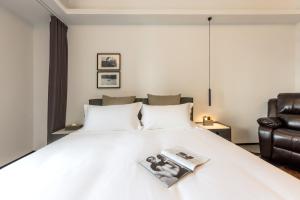 枫雨酒店公寓华强北店-Fengyu Hotel Apartment Shenzhen Huaqiang North Subway Station Branch客房内的一张或多张床位