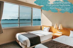 Postel nebo postele na pokoji v ubytování KAMENOI HOTEL Kii-Tanabe