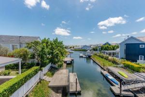 a view of a canal with houses and boats at Island lifestyle on the water in Knysna