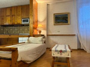 Postel nebo postele na pokoji v ubytování Appartamento A Càsa dei Nòni + 24 fotografií