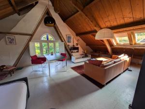 a living room with a couch and a table at Hofstede Prinsland in Kortgene