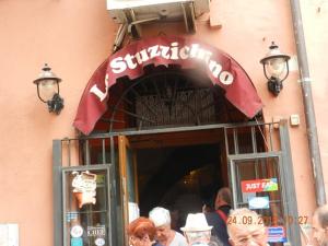a group of people standing outside of a restaurant at Pitico port apartment in Civitavecchia