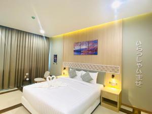 Postel nebo postele na pokoji v ubytování Asawann Hotel Suvarnabhumi