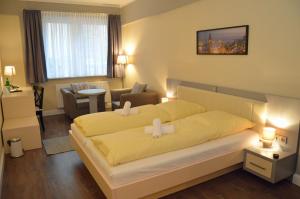 Postel nebo postele na pokoji v ubytování Hotel Jeta + 37 fotografií