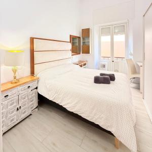 a bedroom with a large bed and a desk at Riad 1 2C in Melilla