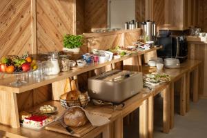 a kitchen with a table with food on it at Villa Tatrica in Kościelisko
