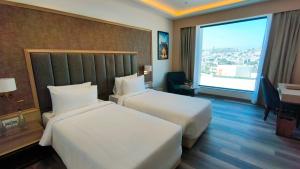 Sarovar Portico Ajmer客房内的一张或多张床位