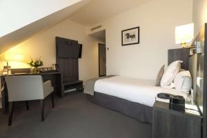 Postelja oz. postelje v sobi nastanitve Best Western Plus Hotel Du Parc Chantilly