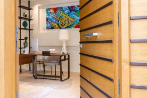 an open door leading to an office with a desk at Hera Rooms and Suites in Agrigento