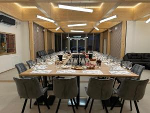 a large conference room with a long table and chairs at Penzion Proneco in Klentnice