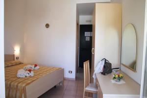 Postel nebo postele na pokoji v ubytování Hotel L'Ancora