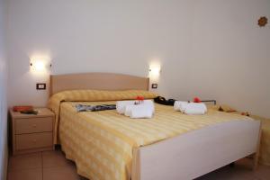 Postel nebo postele na pokoji v ubytování Hotel L'Ancora